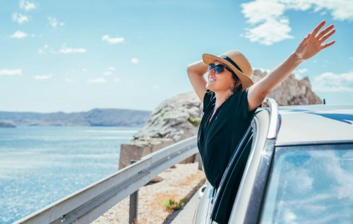 Cheerful,Woman,Portrait,Enjoying,The,Seaside,Road,Trip.,Dressed,A